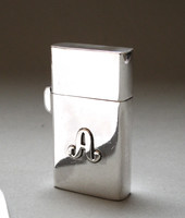 Silver zippo lighter.