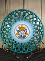Turquoise wall plate with an openwork pattern