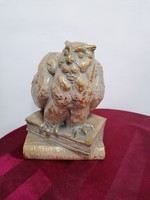 Old ceramic statue of a wise owl