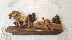 Horses hauling wood in the forest, relief carved in wood
