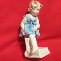 Porcelain figurine of a German girl with books by German Volkstedt.13.5 Cm.