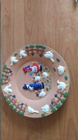 Beautiful decorative plate with naive decoration