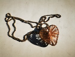 Copper heart pendant on a long chain
