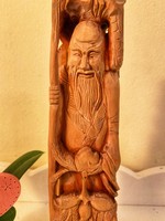 From a forint - a wooden carved oriental male figure
