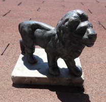 Antique cast solid iron lion statue on marble pedestal