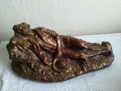 A very rare antique statue of a reclining gentleman, even desk table ornaments