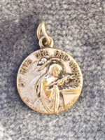 Saint Rita is the defender of hopeless affairs - a silver-plated old pendant