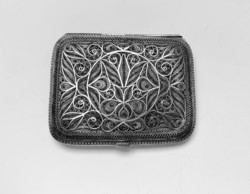 Old, sophisticated filigree silver make-up box or cigarette case.