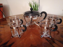 Bodum tea pourer with 3 glass cups, metal holder and a lemon juice pourer. Very nice condition!