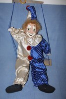 Huge old porcelain-headed clown with a hook