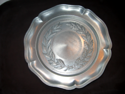 Antique pewter wall plate with laurel wreath pattern, angel mark