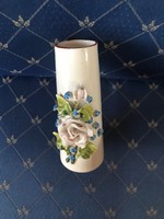 Porcelain vase with plastic flower decoration, without marking.11 Cm high fracture-free condition