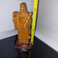 Carved wooden oriental wise statue