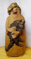 A terracotta statue of Aunt Martha with her kitten. Ceramic work by Andrea Vertel from the 1980s.