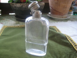 Old drinking glass with metal lid and cap