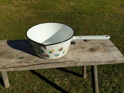 Old vintage enamel flower pattern in enameled large bowl with pouring milk