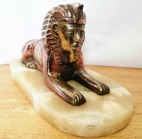 Sphinx, bronze, and copper mixed technique on a green onyx pedestal.