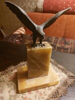 Bronze market bird on an onyx pedestal