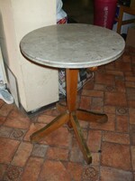 Round table with copper marble top.