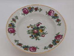 Mz altrohlau is a deep plate that can be hung on a beaded, rosy wall