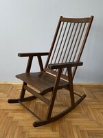 Elegant retro brown color wooden rocking chair with resting chair
