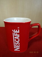 Red porcelain cup with Nescafé inscription, height 9 cm. He has. Jokai