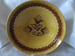 A good large pottery tile bowl that can be hung on the wall