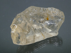 A piece of natural, raw golden marialite (a version of the scapoly) mineral. 7 grams of jewelry base material.