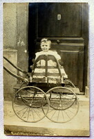 Antique french greeting postcard photo of little kid in extreme stroller
