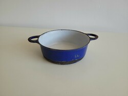 Old antique blue enamel cast iron iron pan with baking dish in pilsner