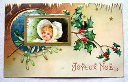 Antique embossed Christmas greeting postcard with little girl holly mistletoe