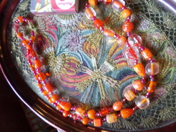 69 cm necklace of mixed orange glass beads.