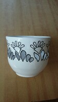 White ceramic pot with openwork black pattern