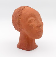 K. J. A terracotta Negro female bust with a sign