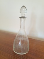 Old corked drinking glass vintage liquor bottle with polished pattern