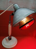 Old table lamp, infrared lamp, or workshop lamp.