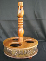 Retro wooden wine holder in a circle with metal grape motif decoration