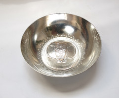 Silver bowl with bull's head decoration.
