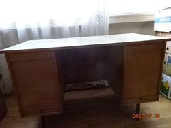 There is a wooden desk and a shutter door to cover the drawers. Hotel. It costs HUF 55/km!