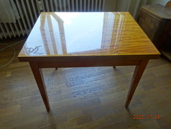 Light brown folding table. Wooden furniture with glossy top. He has! Eagle's Peak