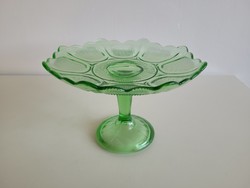 Vintage bowl serving fruit in old stemmed green glass bowl