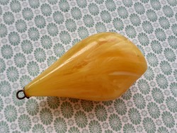 Old female plastic pendant in the shape of a drop