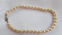 Vintage large-eyed tekla pearl string with silver clasp