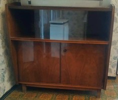 Brown cabinet with glass on top and shelves on the bottom