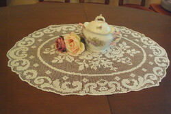 Antique lace table centerpiece, with a rose pattern, in good condition.