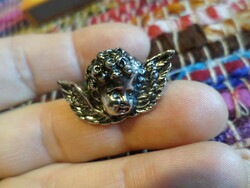 Small (about 3.5 cm), metal angel head, brooch, in good condition.