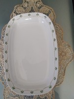 Very old porcelain serving bowl with embossed pattern, gilded garland pattern.