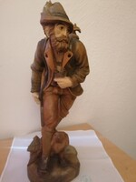 Hunter with dog and prey, carved from wood
