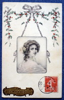 Antique Vienne-type graphic greeting card portrait of a lady in a medallion with a holly garland