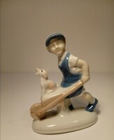 Boy pushing a wheelbarrow with a dog (818)